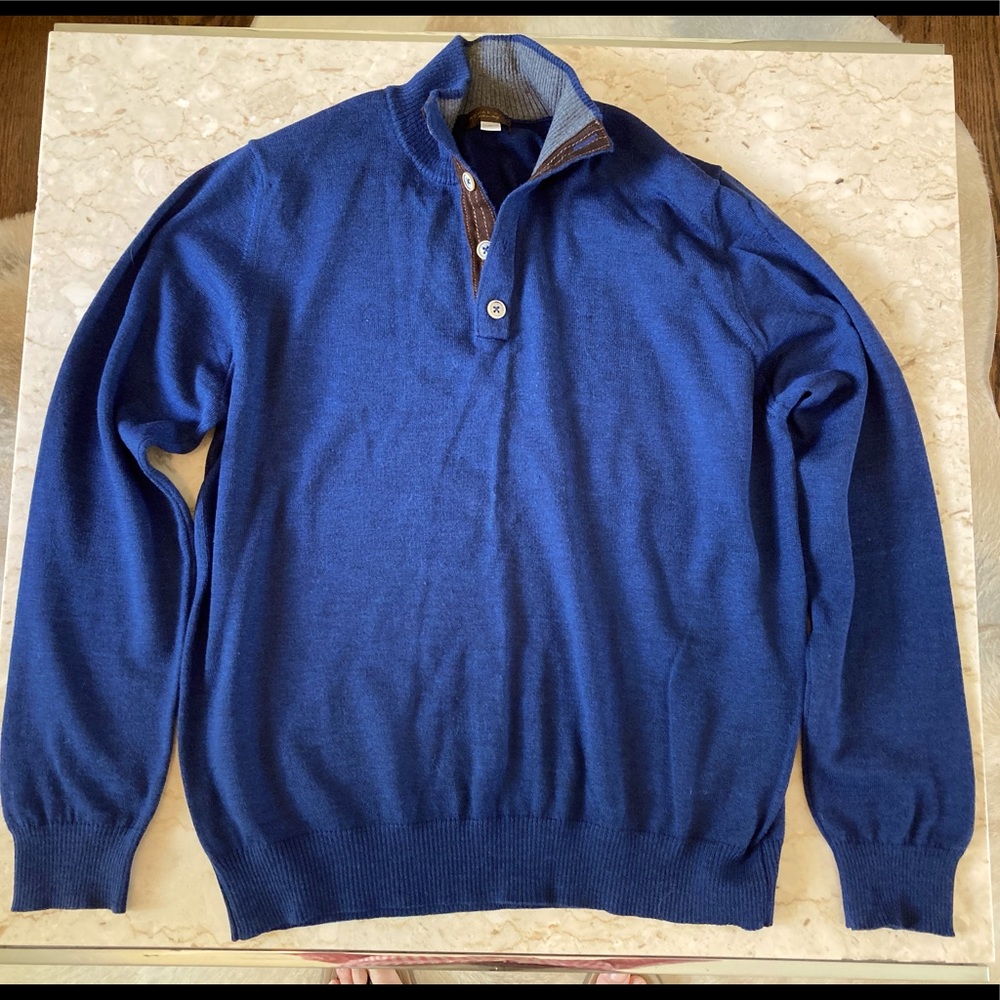 Fine Merino wool sweater with suede trim.